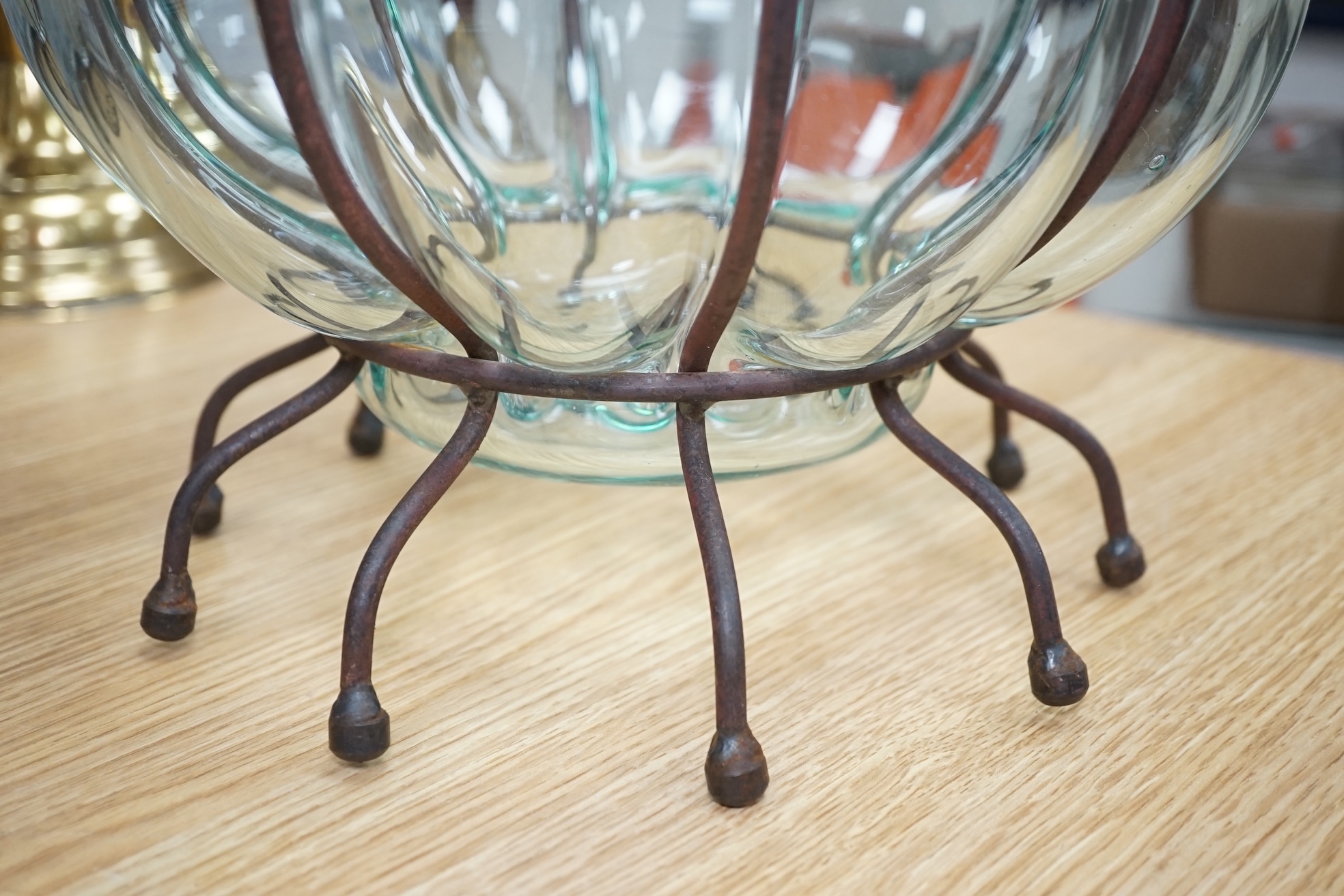 A glass vase and a similar bowl with wrought iron stand, vase 38cm high. Condition - good